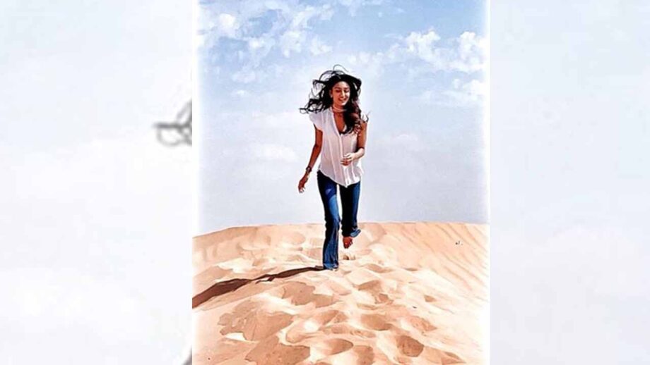 Erica Fernandes walking barefoot in the desert is majestic