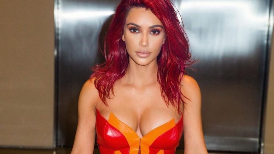 Red Hot: Kim Kardashian's latest strapless red shimmery outfit will make you feel the heat