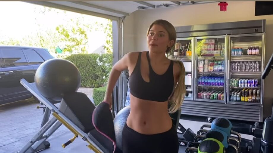 Watch Video: Kylie Jenner's latest hot workout video in black bralette and tight yoga trousers is raising the heat