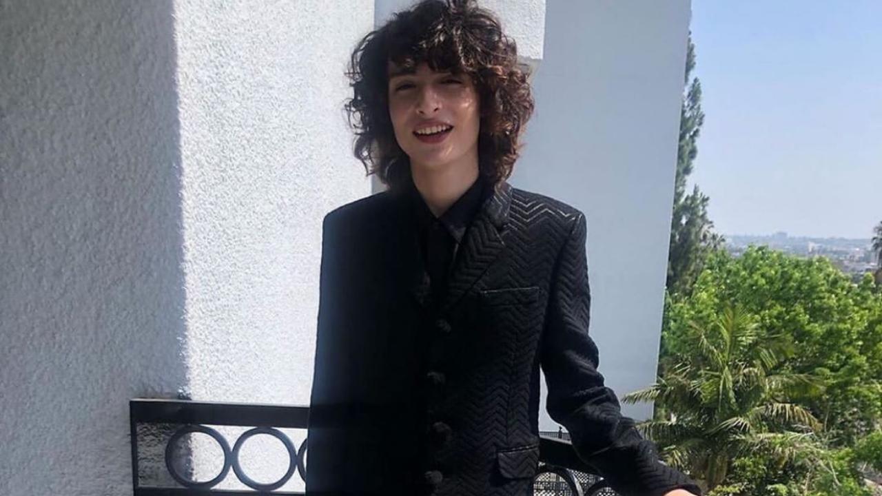 Cute Looks Of Finn Wolfhard, Black Blazer With Black And White Striped ...