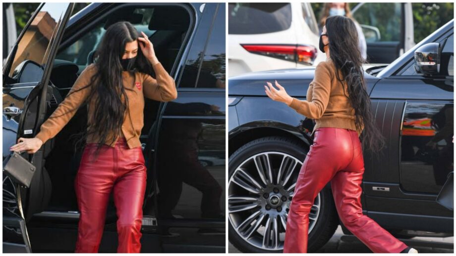 Kourtney Kardashian looks gorgeous in red leather pants and a brown sweater 376396