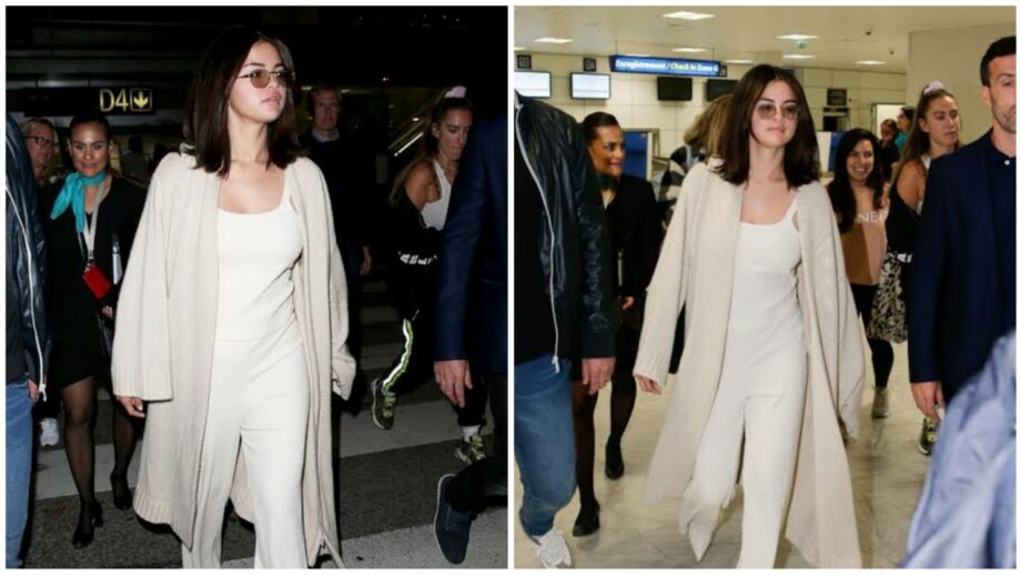 Selena Gomez's Luxurious Airport Looks Will Shock You- A Ribbed Gray-White Top And Trousers, Chunkier Ivory Sweater On Top, Pointy Boots & Stark White Leather 446673