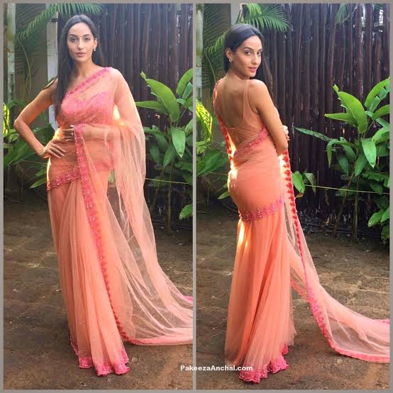 Nora Fatehi and Kriti Sanon raise the temperature with their sensuous backless  saree designs, fans sweat
