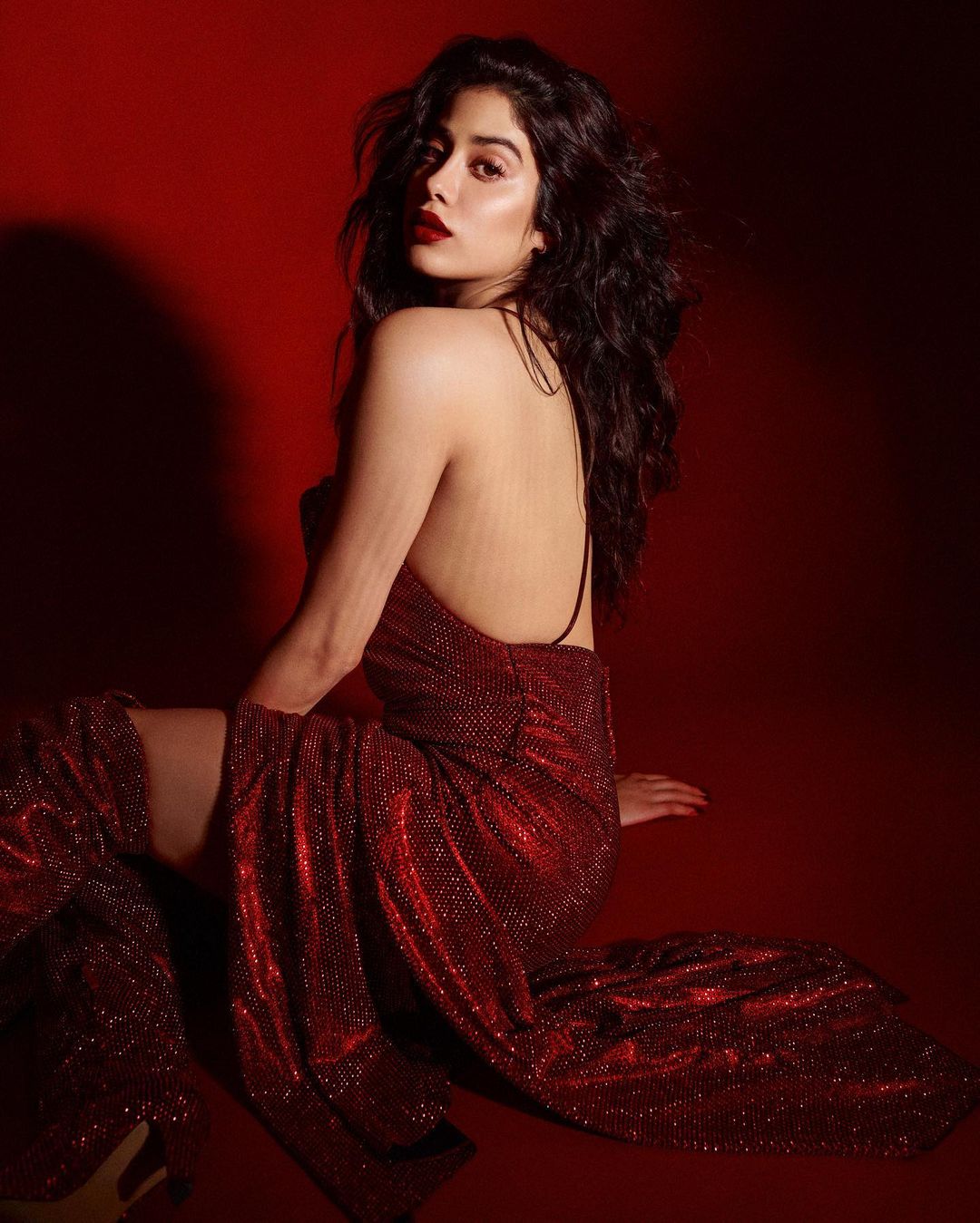 Janhvi Kapoor sparkles in glittery backless red flared gown, Arjun Kapoor says “time to make merry” | IWMBuzz
