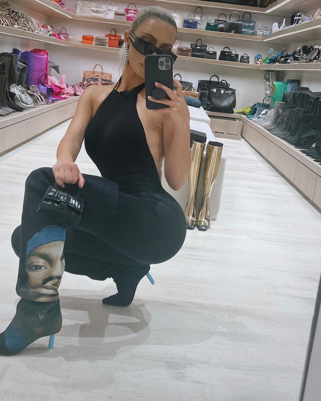 Kim Kardashian Looks Divine In Black Halter Neck Backless Bodysuit