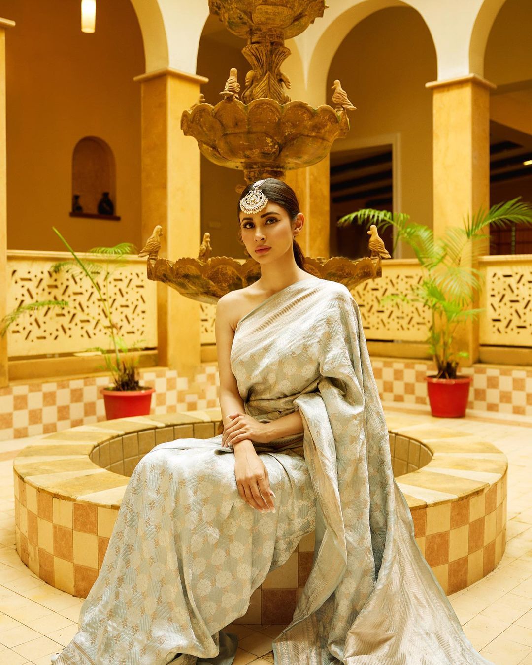 Take a look at Mouni Roy in her ethnic saree with an off-shoulder blouse on...