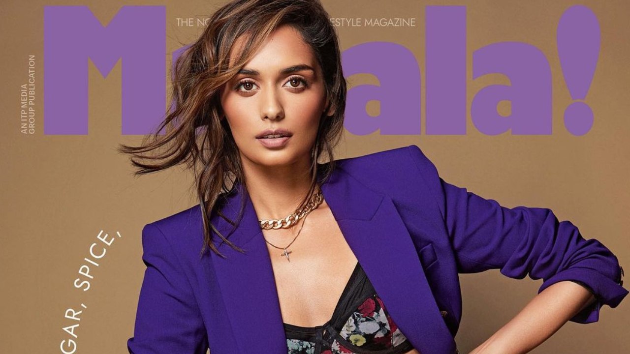 Manushi Chhillar features on the cover of Masala magazine a floral bralette with black leather pants and a blue blazer