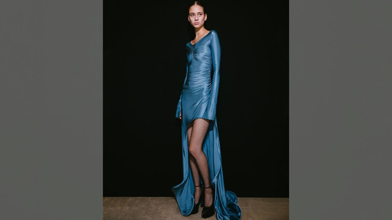 Victoria Beckham Looks Typically Chic In A Figure-Hugging Blue Satin Gown 783658