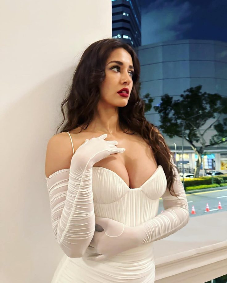 Disha Patani curls Victorian glam in white corset deep neck gown with red lips [Photos] 854611