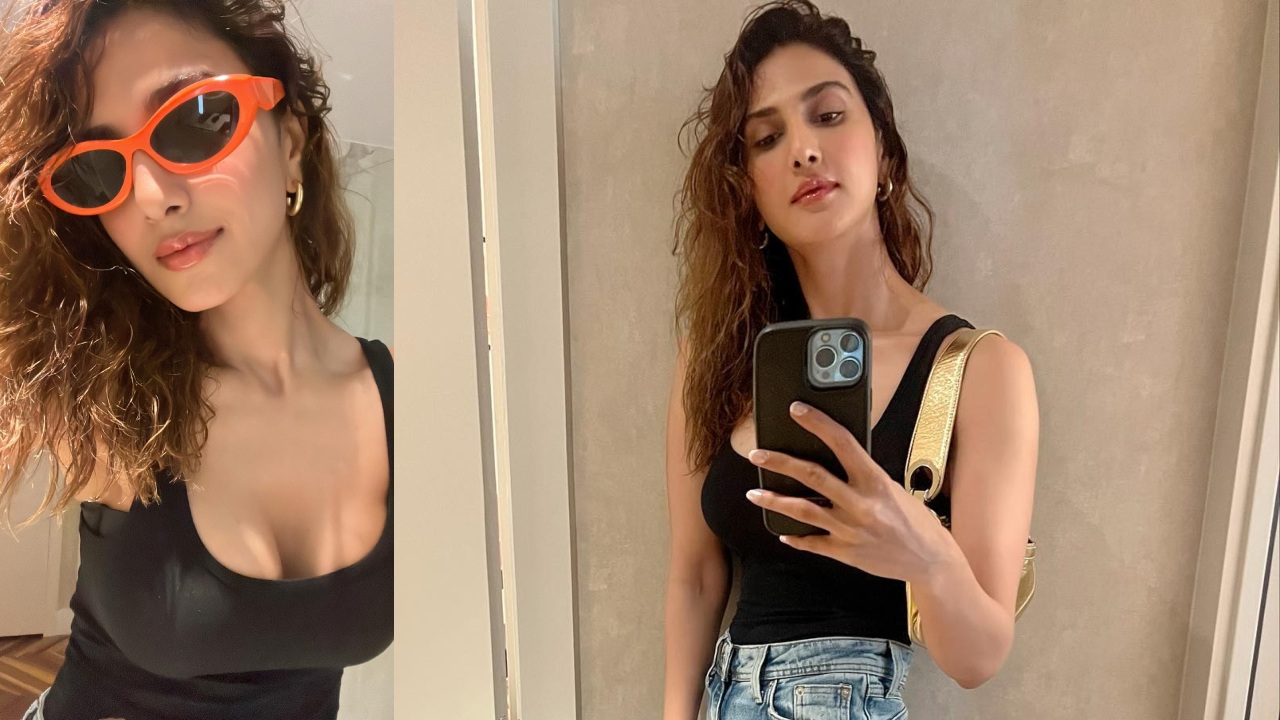 In Photos: Vaani Kapoor Spreads Casual Charm In Black Low Neckline Top And Ripped Denim 850185