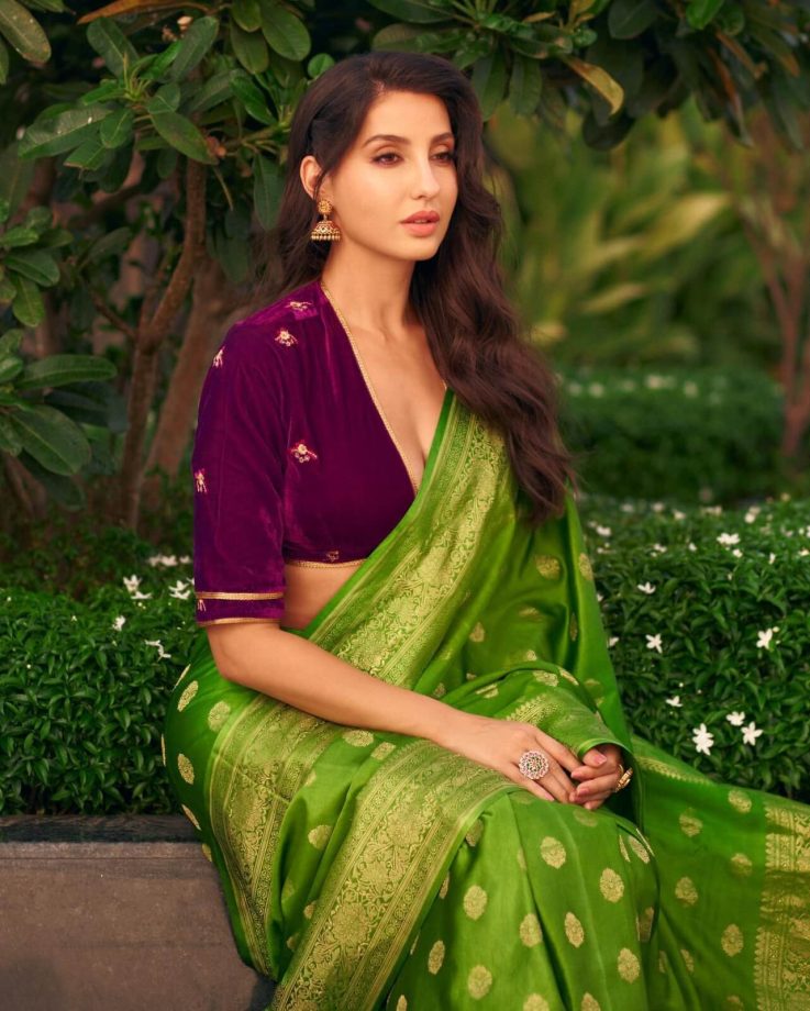 Nora Fatehi looks divine in velvet deep neck blouse and green saree 850190