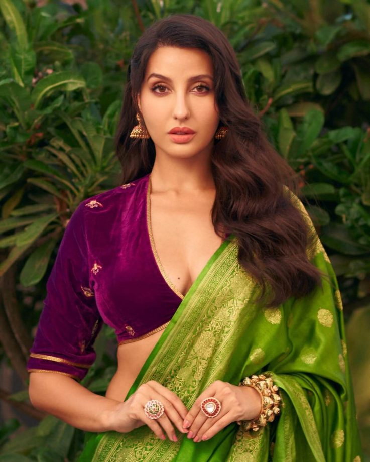 Nora Fatehi looks divine in velvet deep neck blouse and green saree 850191