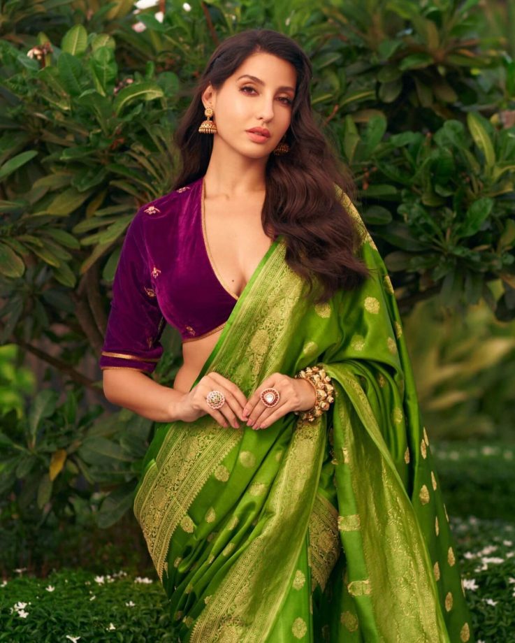Nora Fatehi looks divine in velvet deep neck blouse and green saree 850192