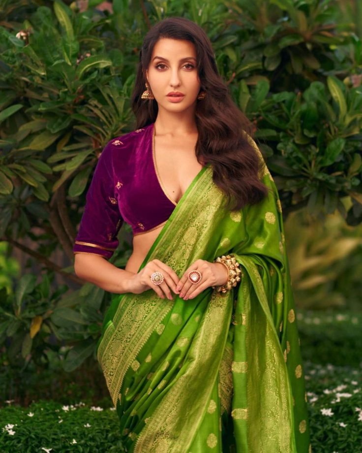Nora Fatehi looks divine in velvet deep neck blouse and green saree 850193