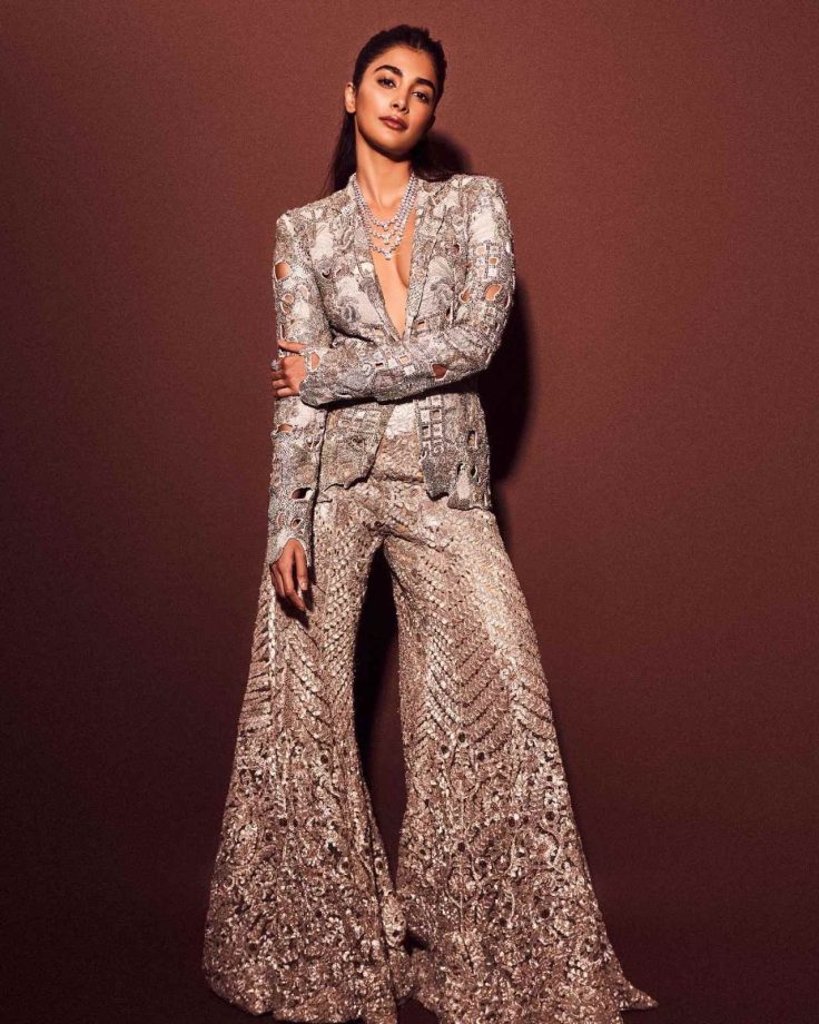 [Photos] Pooja Hedge Radiates Charm In Sparkling Silver Plunge-neckline Blazer And Trouser With Statement Accessories 851324
