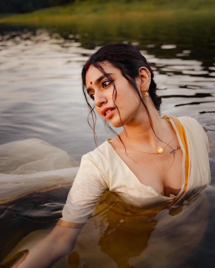 In Photos: Priya Varrier Looks Sizzling In Traditional White Saree As She Poses Inside Lake 861703