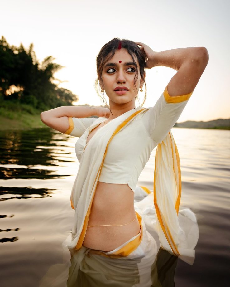 In Photos: Priya Varrier Looks Sizzling In Traditional White Saree As She Poses Inside Lake 861701