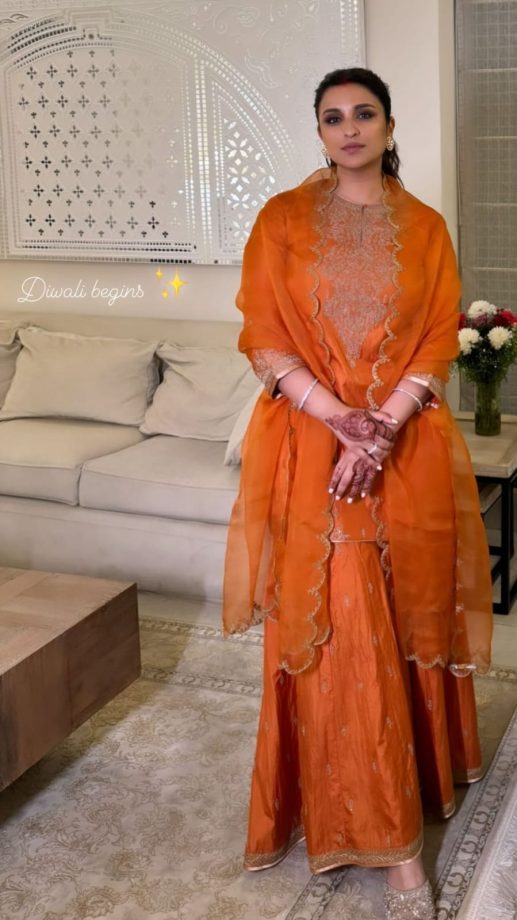 “Diwali Begins,” Parineeti Chopra blooms in orange silk embellished sharara set [Photos] 866983