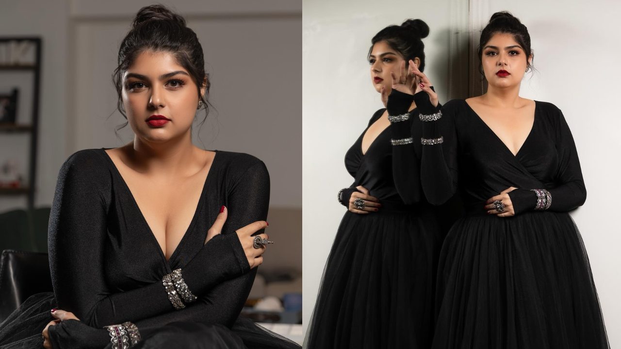Stunner! Anshula Kapoor owns the deep plunge neck in black flared gown dress