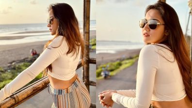 Ashi Singh ups beach sass in crop top and multicoloured trouser