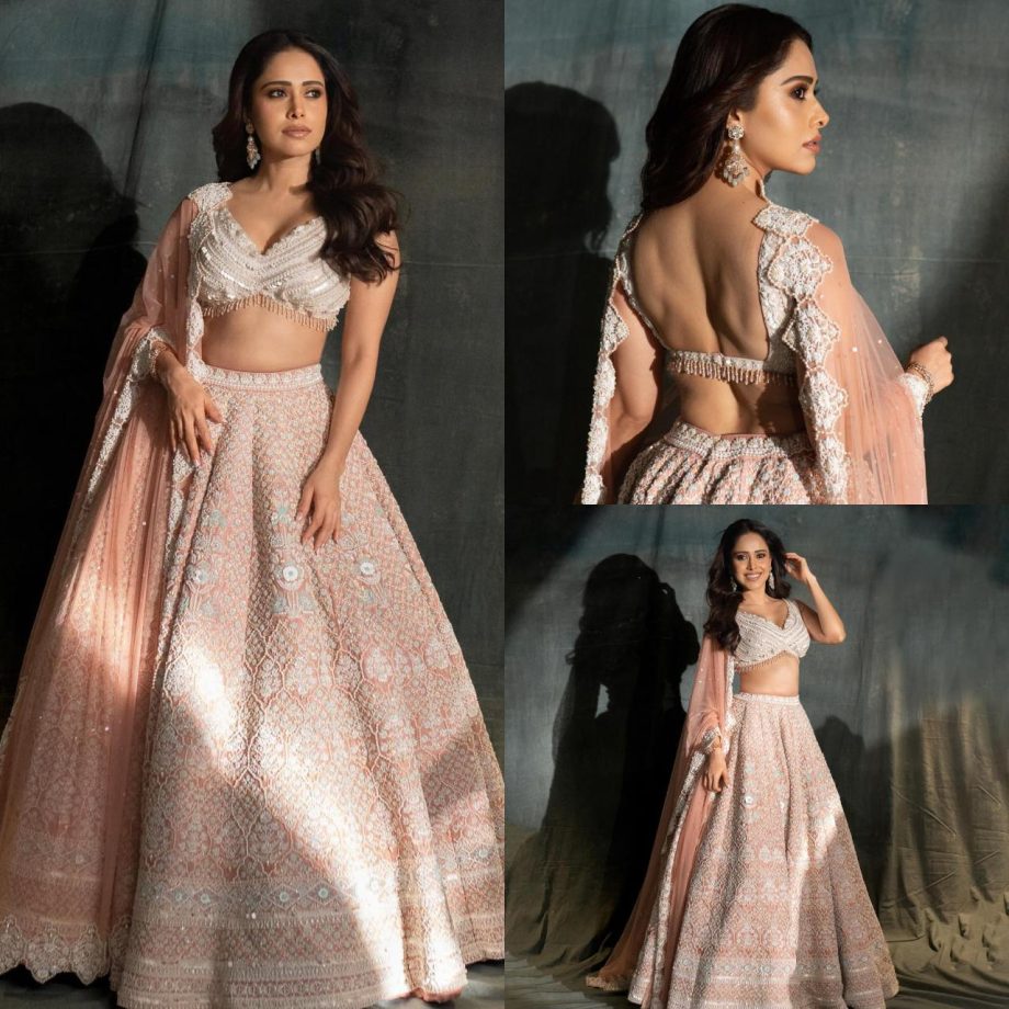 Glamorous Beauty: Nushrratt Bharuccha Radiates Elegance in an Ethereal Pink Bridal Lehenga Set 893218