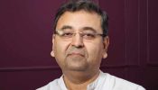 Director Indrasis Acharya Returns to Corporate Job Due to Financial Security Concerns