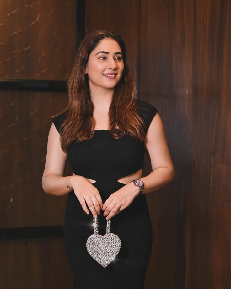 Rahul Vaidya Awestruct As Disha Parmar Stuns In Black Bodycon Dress With Silver Heart Handbag 904333