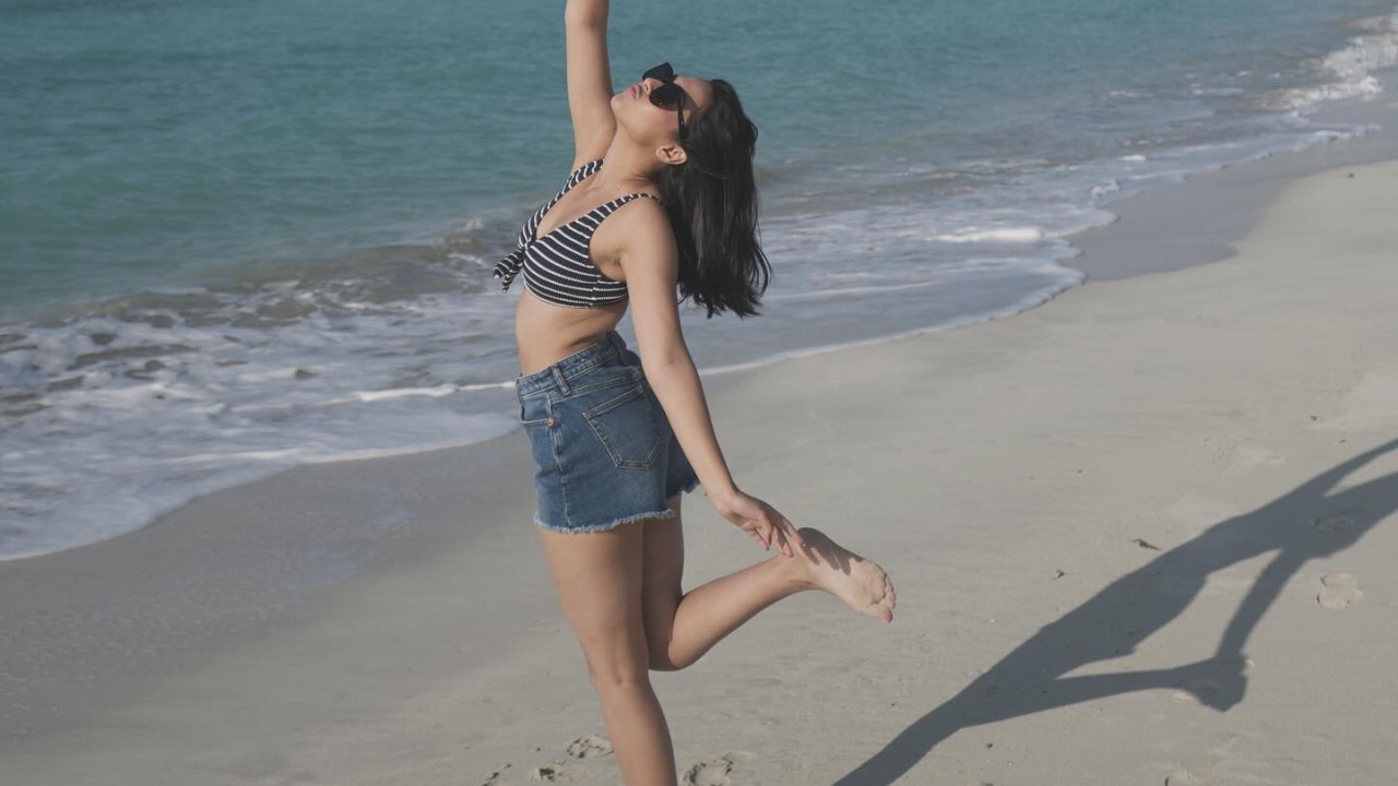 Reem Shaikh Slays Beach Fashion In Denim Short And Striped Bralette Top With A Chic Cowhat 930762