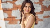 Tejasswi Prakash Stuns in a Fitted Yellow Dress with Flare