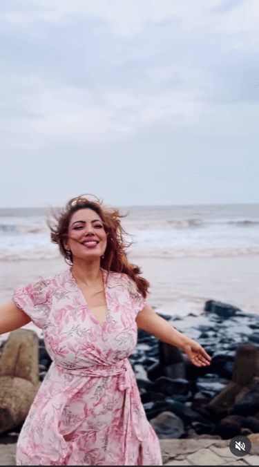 TMKOC's Munmun Dutta Embraces Monsoon Bliss In Floral Dress On Serene Beach Day 955579