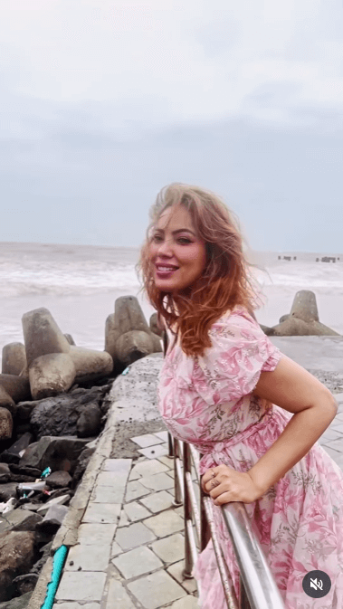 TMKOC's Munmun Dutta Embraces Monsoon Bliss In Floral Dress On Serene Beach Day 955581