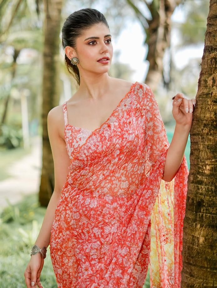 Sanjana Sanghi Shines in Vibrant Orange Floral Saree and Chic Low-Back Blouse 963388