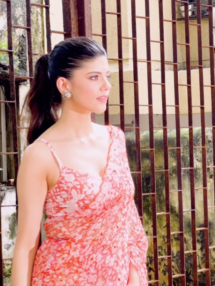 Sanjana Sanghi Shines in Vibrant Orange Floral Saree and Chic Low-Back Blouse 963394
