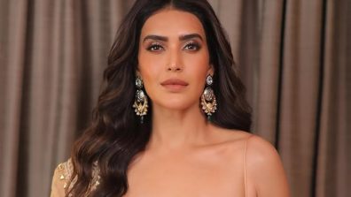 Karishma Tanna Dazzles in a Regal Golden Ensemble