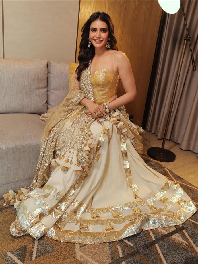 Karishma Tanna Dazzles in a Regal Golden Ensemble 971191