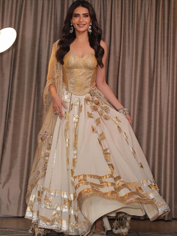 Karishma Tanna Dazzles in a Regal Golden Ensemble 971192