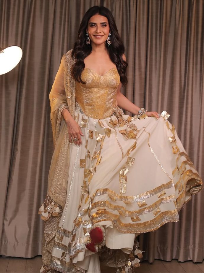 Karishma Tanna Dazzles in a Regal Golden Ensemble 971190