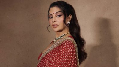Jacqueline Fernandez Radiates Classic Bridal Charm in Timeless Red Benarasi Saree