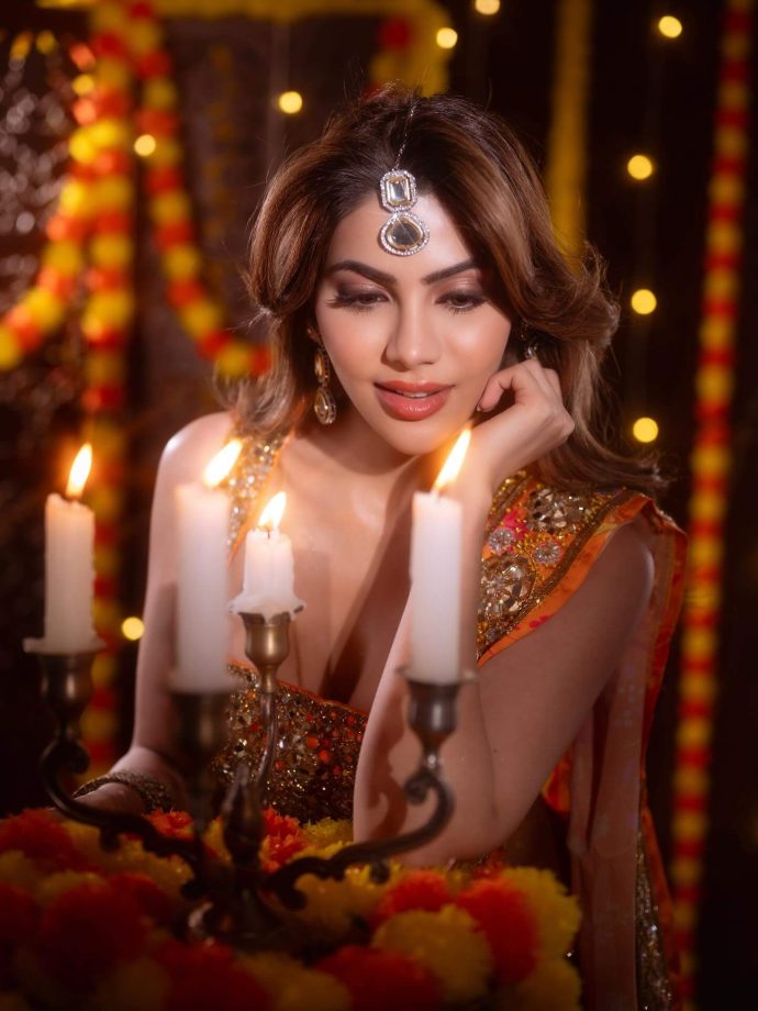 Nikki Tamboli Dazzles in a Fiery Orange Saree 976304