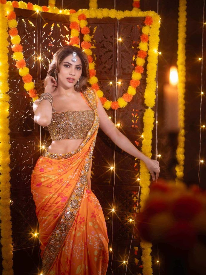 Nikki Tamboli Dazzles in a Fiery Orange Saree 976306