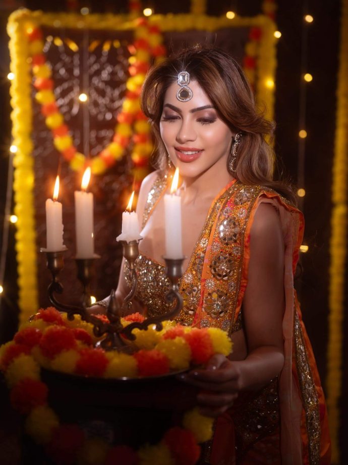 Nikki Tamboli Dazzles in a Fiery Orange Saree 976301