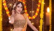 Nikki Tamboli Dazzles in a Fiery Orange Saree