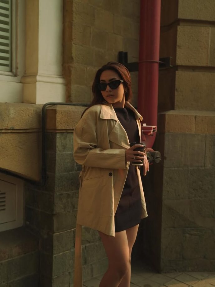 Reem Sameer Serves Effortless Street Style in a Chic Black Dress and Beige Trench Coat 984617