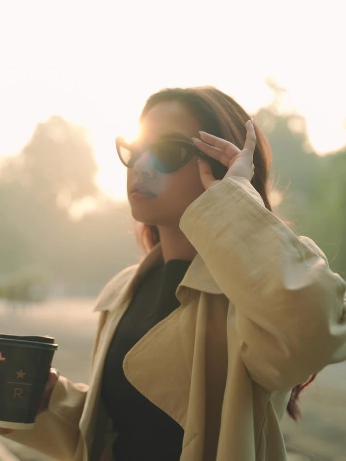 Reem Sameer Serves Effortless Street Style in a Chic Black Dress and Beige Trench Coat 984618