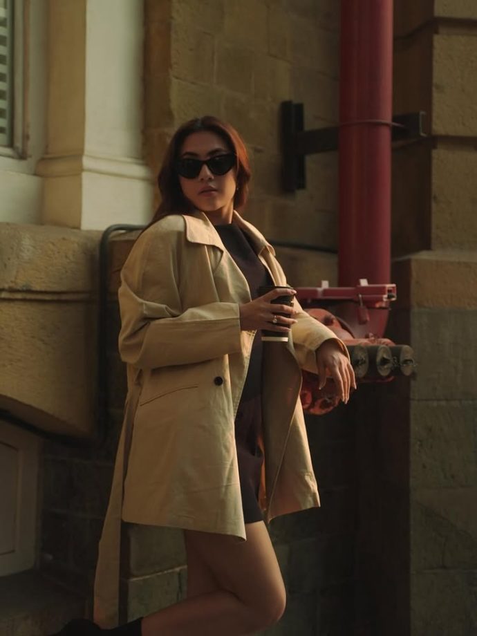 Reem Sameer Serves Effortless Street Style in a Chic Black Dress and Beige Trench Coat 984621