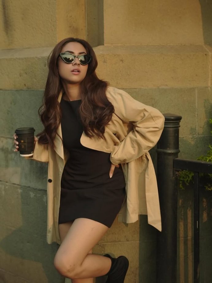 Reem Sameer Serves Effortless Street Style in a Chic Black Dress and Beige Trench Coat 984620