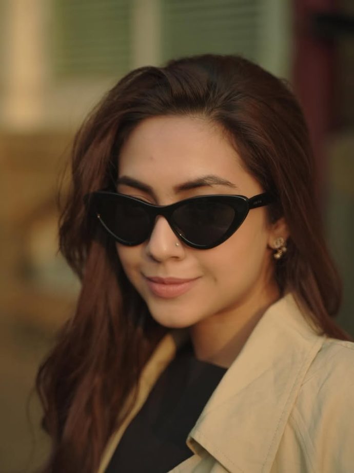 Reem Sameer Serves Effortless Street Style in a Chic Black Dress and Beige Trench Coat 984619