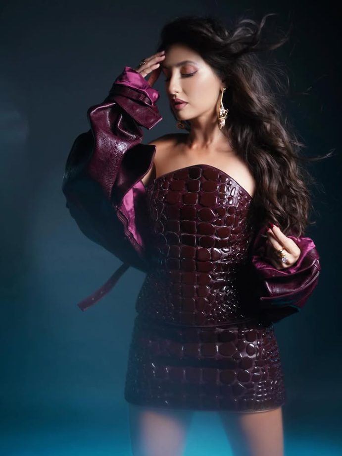 Nora Fatehi Makes a Bold Style Statement in a Deep Wine Mini Dress 984575