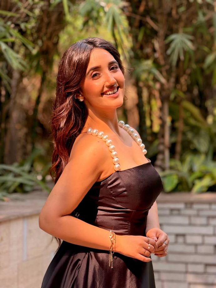 Ashnoor Kaur Stuns in a Chic Black Dress with Elegant Pearl Details 989808