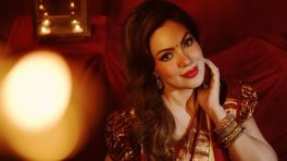 Munmun Dutta brings timeless elegance in a classic red and gold saree look